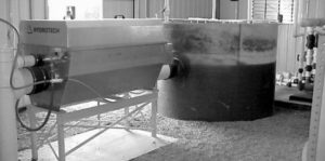 Drum filter efficiency as particle separator in a recirculated system